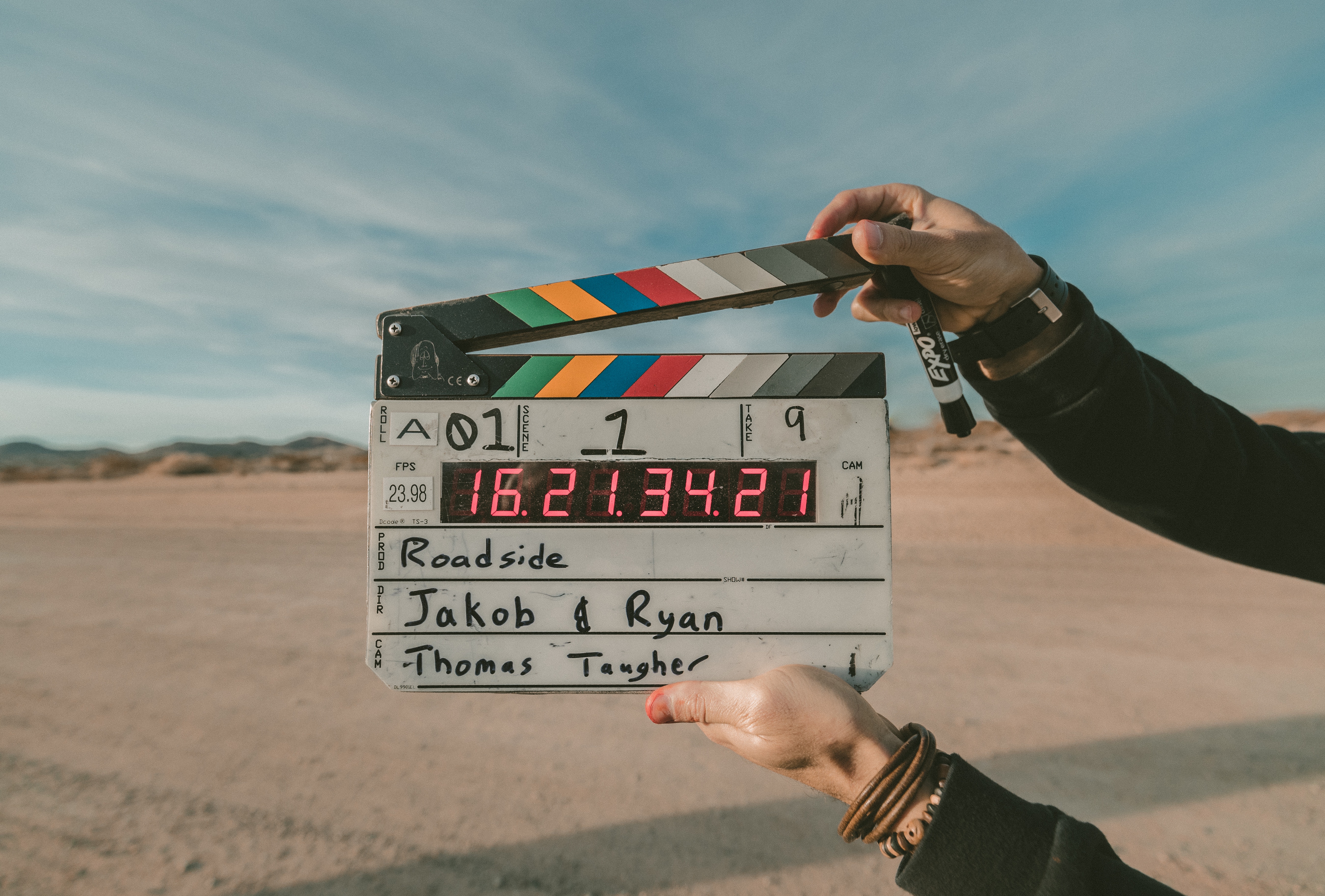 man holding a clapperboard