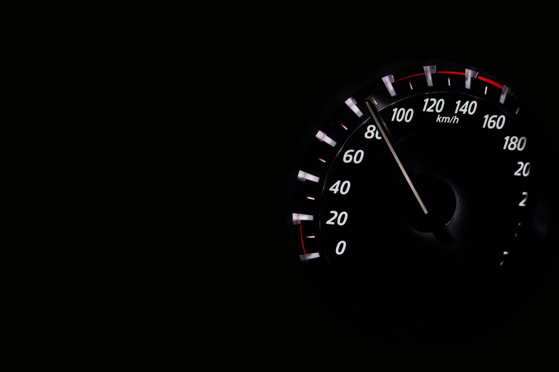 Speedometer glowing on a dark background