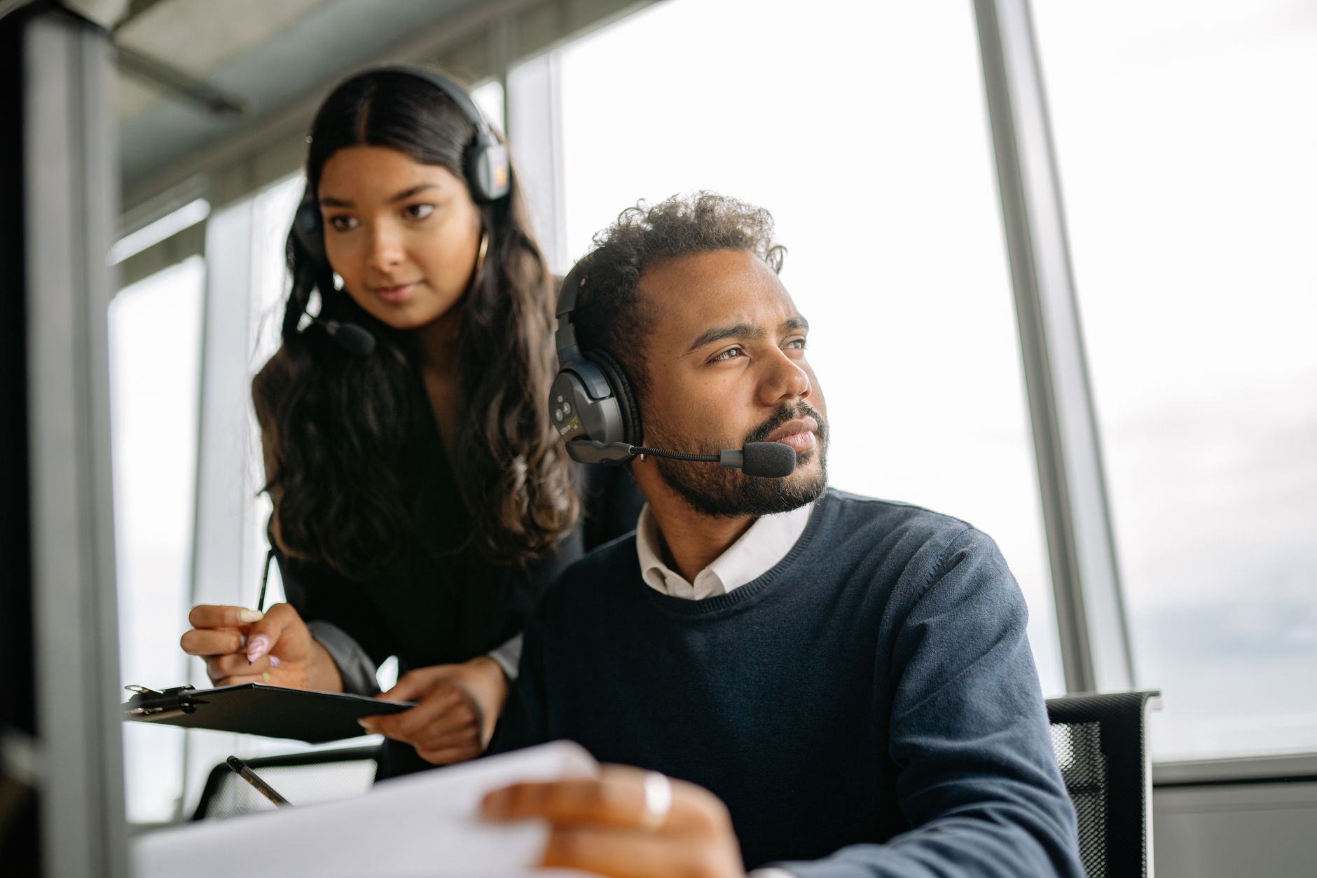 Support team members working with headsets